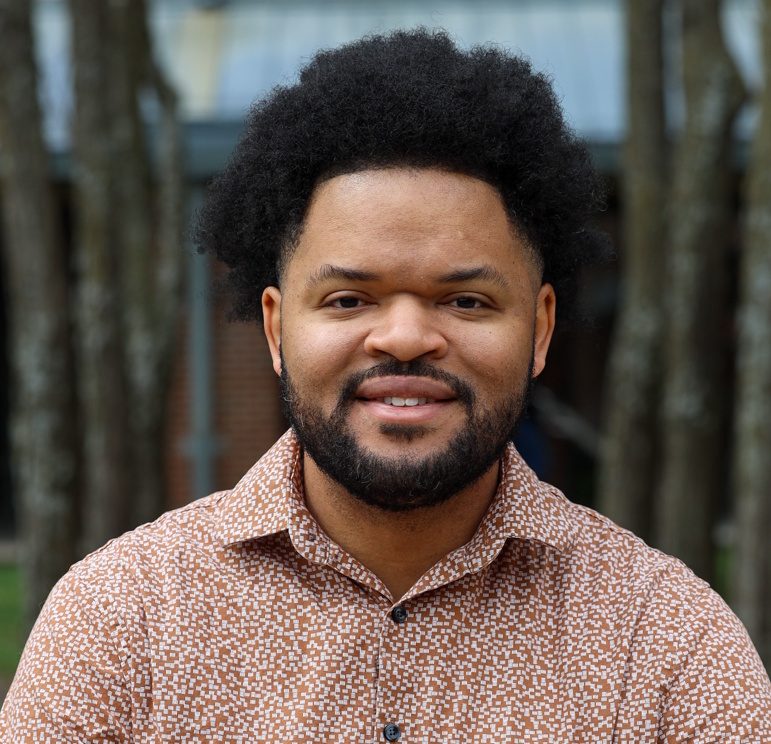 Founder headshot, candid working shot, real person, direct eye contact